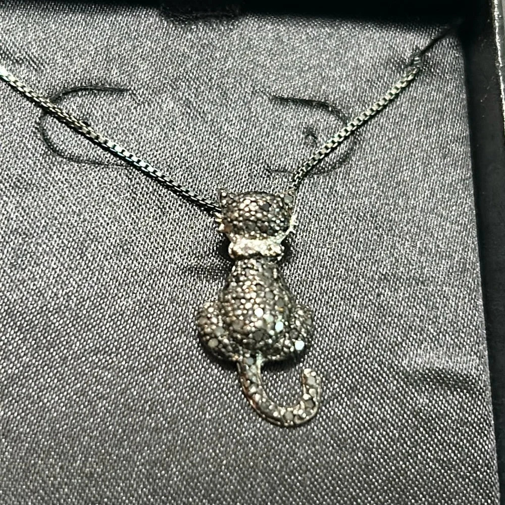 Stylish Silver Cat Charm Necklace with Intricate Details